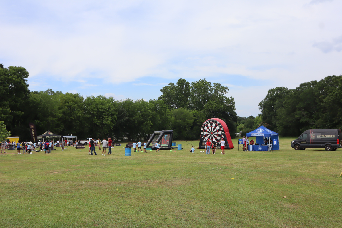 GALLERY: Local youth joined by Atlanta United for mini soccer pitch ribbon kicking event